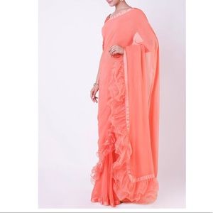 Latest Ruffled peach-pink saree with velvet blouse